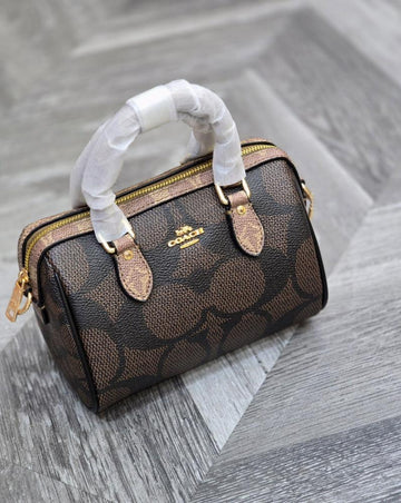MINI ROWAN CROSSBODY BAG IN BLOCKED SIGNATURE CANVAS
